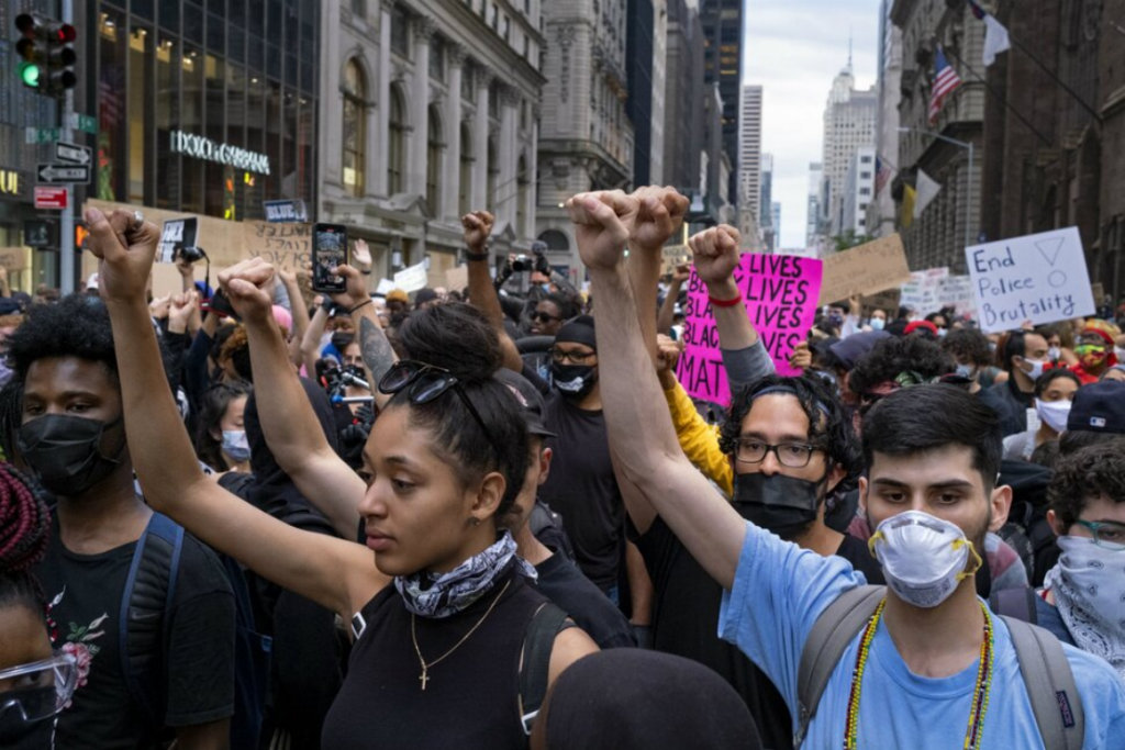 Protesters and activists move along 5th Ave. Tuesday, June 2, 2020, in New York City.

