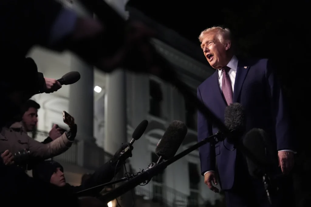 President Donald Trump talks to the media as he walks to Marine One from the White House, Friday, Dec. 19, 2025, in Washington. (AP Photo/Julia Demaree Nikhinson, File)