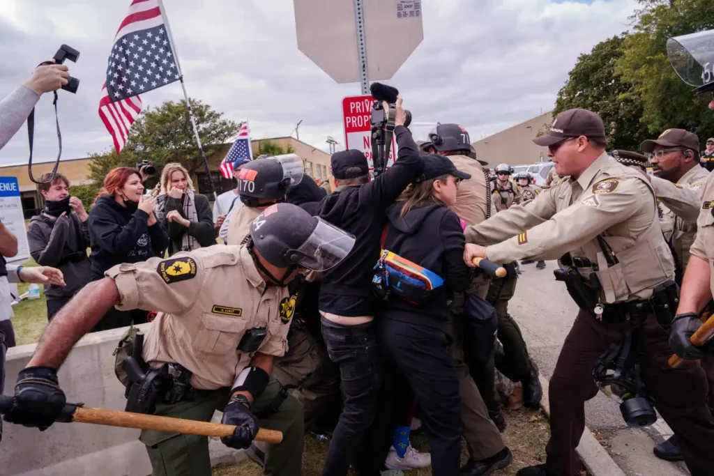 Illinois State Police and Cooks County Sheriffs move in to detain protesters outside the U.S. Immigration and Customs Enforcement facility in Broadview, IIl., Saturday, Oct. 11, 2025. (AP Photo/Adam Gray, File)