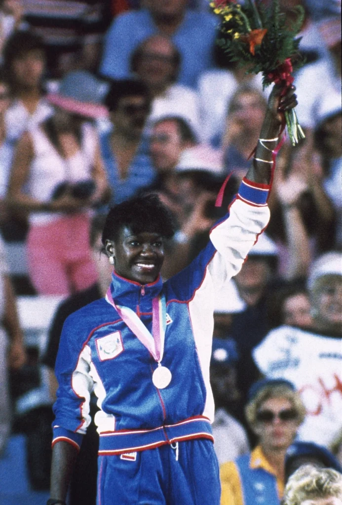 Benita Fitzgerald-Brown on the podium after winning the gold medal in the Women's 100 meter Hurdles Event at the Summer Olympic Games in Los Angeles, California, USA on Aug. 10, 1984. (AP Photo/Paul Benoit, File)