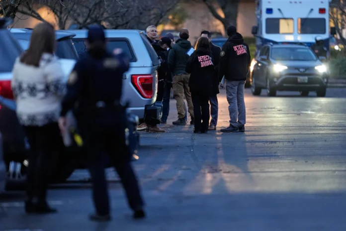 Law enforcement officials work the scene following reports that federal immigration officers shot and wounded people in Portland, Ore., Thursday, Jan. 8, 2026. (AP Photo/Jenny Kane)