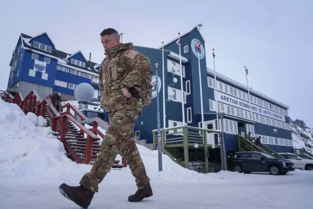 A Danish serviceman walks in front of Joint Arctic Command center in Nuuk, Greenland, on Jan. 16, 2026. (AP Photo/Evgeniy Maloletka, File)