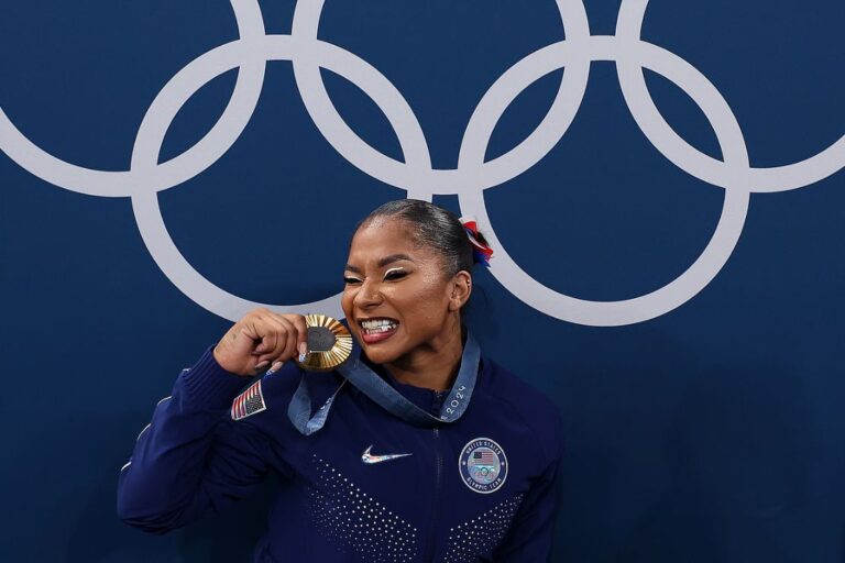 Gold medalist Jordan Chiles of Team United States poses with the Olympic Rings during the medal ceremony during the Artistic Gymnastics Women's Team Final on day four of the Olympic Games Paris 2024 at Bercy Arena on July 30, 2024 in Paris, France. (Photo by Naomi Baker/Getty Images)