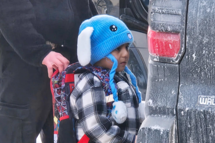 Liam Conejo Ramos, 5, is detained by U.S. Immigration and Customs Enforcement officers after arriving home from preschool, Tuesday, Jan. 20, 2026, in a Minneapolis suburb. (Ali Daniels via AP)