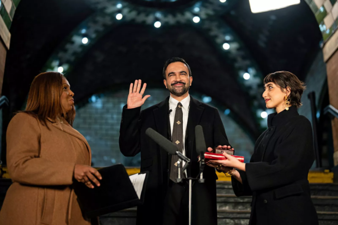 Zohran Mamdani is sworn in as New York City's 112th mayor by New York Attorney General Letitia James, left, alongside his wife Rama Duwaji, right, in the former City Hall subway station on January 1, 2026 in New York City. Pool/Getty Images North America