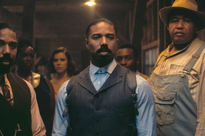 This image released by Warner Bros Pictures shows Michael B. Jordan, foreground from left, Michael B. Jordan and Omar Benson Miller in a scene from 