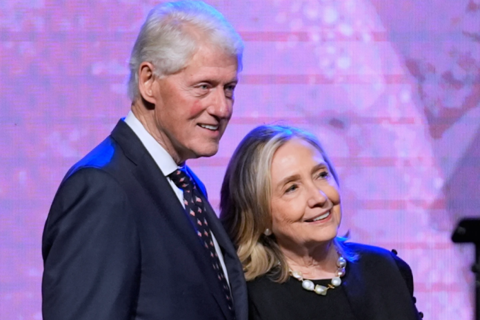 Former President Bill Clinton, left, and former Secretary of State Hillary Clinton listen as Vice President Kamala Harris delivers a eulogy for U.S. Rep. Sheila Jackson Lee, Aug. 1, 2024, in Houston. (AP Photo/LM Otero, File)
