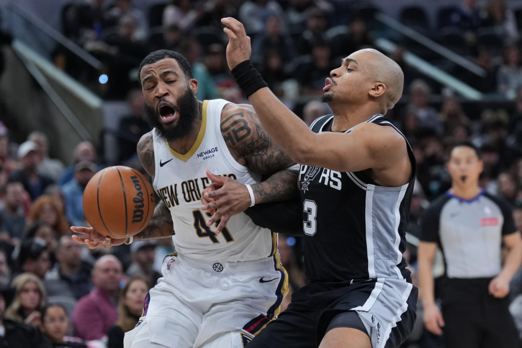 New Orleans Pelicans guard Saddiq Bey(41) drives against San Antonio Spurs forward Keldon Johnson (3) during the first half of an NBA basketball game in San Antonio, Sunday, Jan. 25, 2026. (AP Photo/Eric Gay)