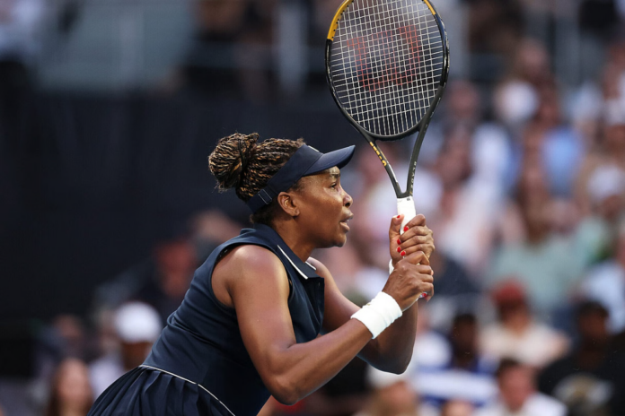 Venus Williams of United States looks on against Olga Danilovic of Serbia during the Women's Singles First Round match on day one of the 2026 Australian Open at Melbourne Park on January 18, 2026 in Melbourne, Australia. (Photo by Morgan Hancock/Getty Images)