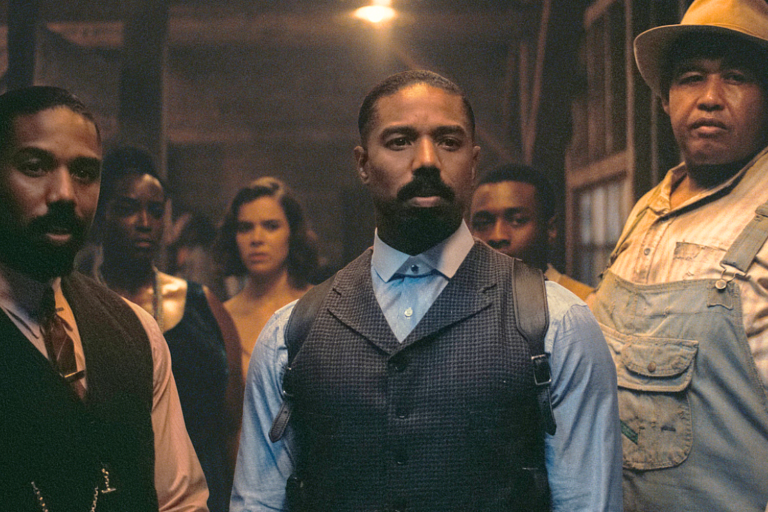 This image released by Warner Bros Pictures shows Michael B. Jordan, foreground from left, Michael B. Jordan and Omar Benson Miller in a scene from "Sinners." (Warner Bros. Pictures via AP) Link Copied