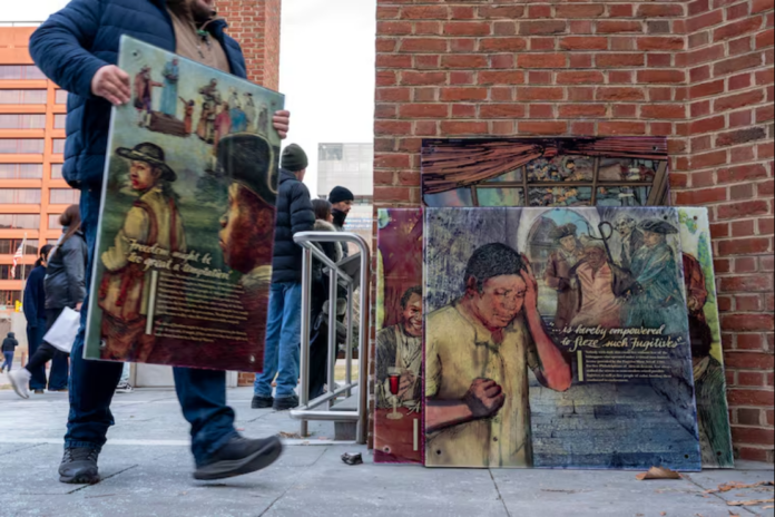Workers remove display panels about slavery at the President’s House site in Independence National Historical Park Thursday, Jan. 22, 2026. Tom Gralish / Staff Photographer