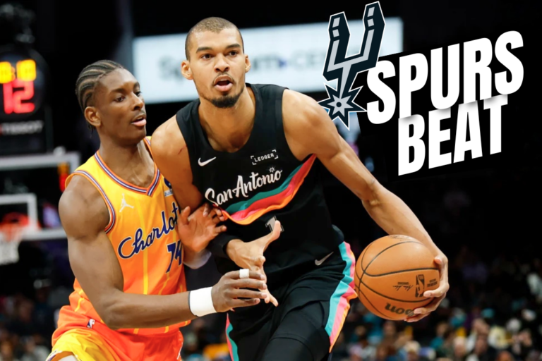 San Antonio Spurs forward Victor Wembanyama, right, moves the ball against Charlotte Hornets forward Moussa Diabate during the first half of an NBA basketball game in Charlotte, N.C., Saturday, Jan. 31, 2026. (AP Photo/Nell Redmond)