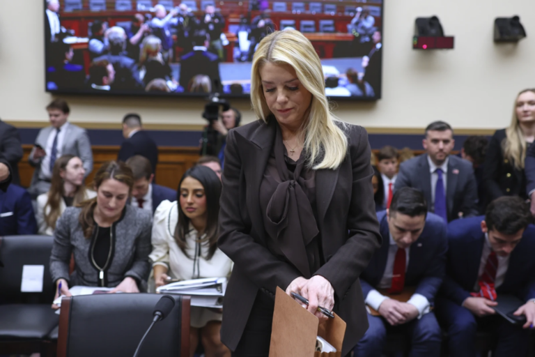 Attorney General Pam Bondi prepares to depart after testifying before a House Judiciary Committee oversight hearing on Capitol Hill in Washington, Wednesday, Feb. 11, 2026, in Washington. (AP Photo/Tom Brenner)