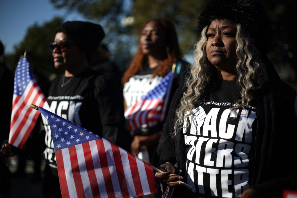 Activists hold signs during a rally in front of the U.S. Supreme Court in Washington, DC. 