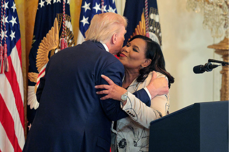 Donald Trump greets criminal justice reform advocate Alice Johnson during a Black History Month reception in the East Room of the White House on February 18, 2026 in Washington DC. The president issued a proclamation recognizing Black History Month on Feb. 3. (Photo by Chip Somodevilla/Getty Images)