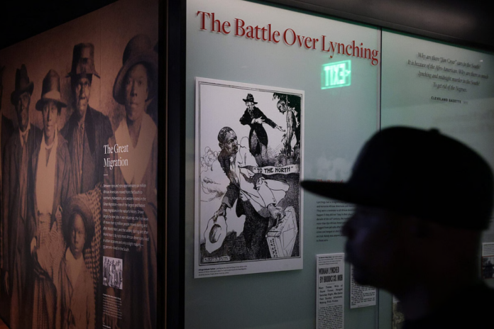 A visitor browses an exhibition about 