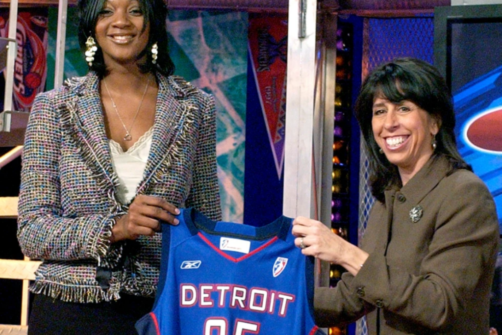 Kara Braxton, left, holds up a Detroit Shock jersey with WNBA President Donna Orender after the Shock selected her as their first round pick, seventh overall in the WNBA draft, April 16, 2005, in Secaucus, N.J. (AP Photo/Bill Kostroun, file)
