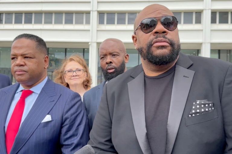 Isaac Hayes III, right, and his attorney address reporters outside a federal courthouse in Atlanta, Sept. 3, 2024. (AP Photo/Kate Brumback, File)