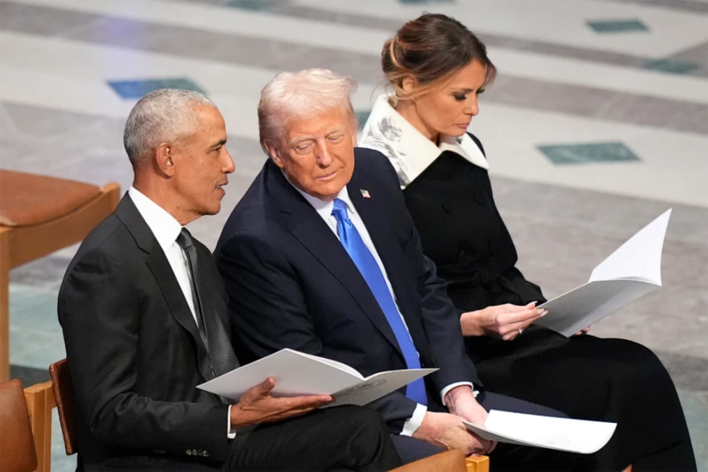 Former President Barack Obama talks with then President-elect Donald Trump as Melania Trump reads the funeral program before the state funeral for former President Jimmy Carter at Washington National Cathedral in Washington, Jan. 9, 2025. (AP Photo/Jacquelyn Martin, File)