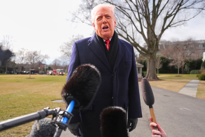 President Donald Trump takes questions from reporters before departing on Marine One from the South Lawn of the White House, Jan. 16, 2026, in Washington. Evan Vucci/AP