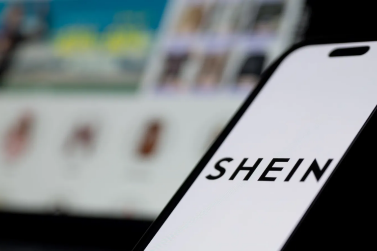The Shein logo and website are displayed on screens. Ben Montgomery via Getty Images