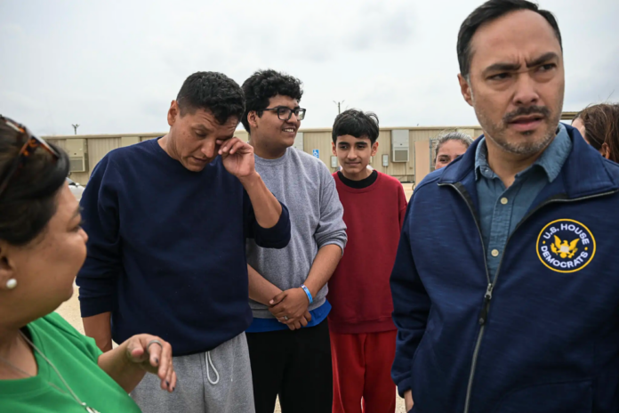 Mr. Gámez wipes away a tear after being released with his wife and two of his sons on Monday. Credit...Tamir Kalifa for The New York Times