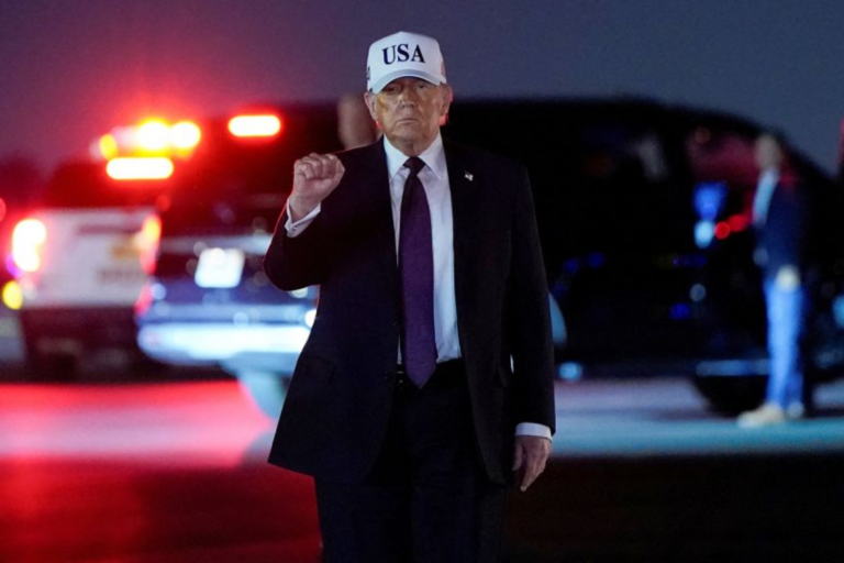US President Donald Trump pumps his fist after disembarking Air Force One at Palm Beach International Airport in West Palm Beach, Florida, on Friday. Elizabeth Frantz/Reuters