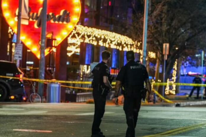 Police officers guard the scene on West 6th Street at West Avenue after a shooting, Sunday March 1, 2026, in Austin, Texas. (Ricardo B. Brazziell/Austin American-Statesman via AP)