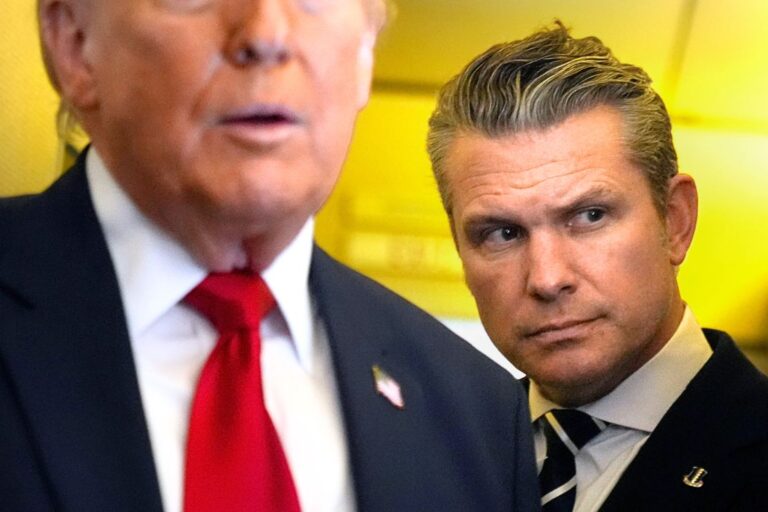 Defense Secretary Pete Hegseth listens as President Donald Trump speaks to reporters while traveling aboard Air Force One en route from Dover Air Force Base, Del., to Miami, Saturday, March 7, 2026. (AP Photo/Mark Schiefelbein)