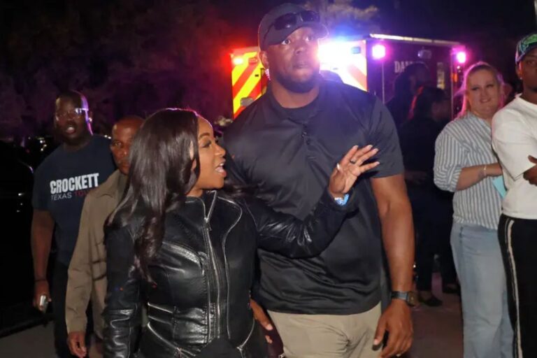 Rep. Jasmine Crockett walking with security guard Diamon-Mazairre Robinson, also known as Mike King, at a campaign event in Dallas before he was killed in a police standoff.