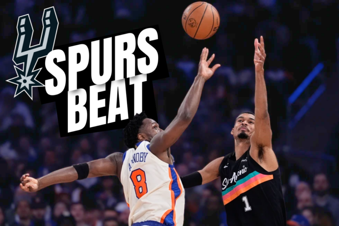 San Antonio Spurs’ Victor Wembanyama, top, shoots over New York Knicks’ Og Anunoby and Karl-Anthony Towns during the first half of an NBA basketball game Sunday, March 1, 2026, in New York. AP Photo Seth Wenig