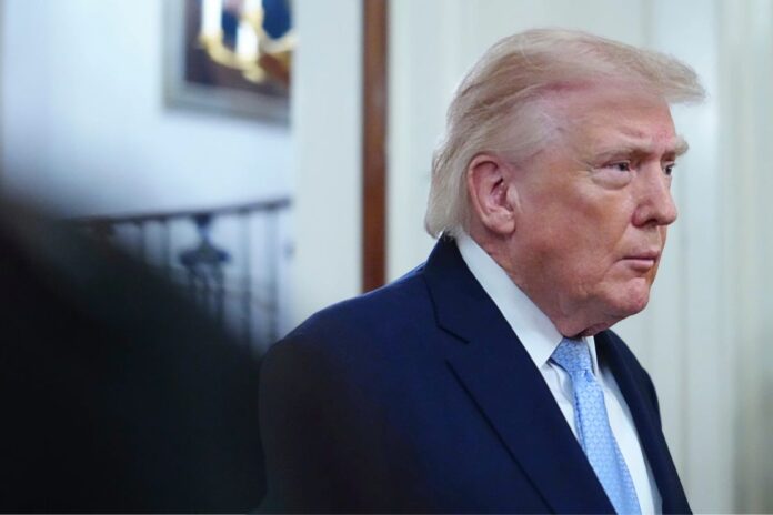 President Donald Trump arriving to speak at the Commander-in-Chief's Trophy presentation with the Navy Midshipmen football team in the East Room of the White House, Friday, March 20, 2026, in Washington. (AP Photo/Julia Demaree Nikhinson)