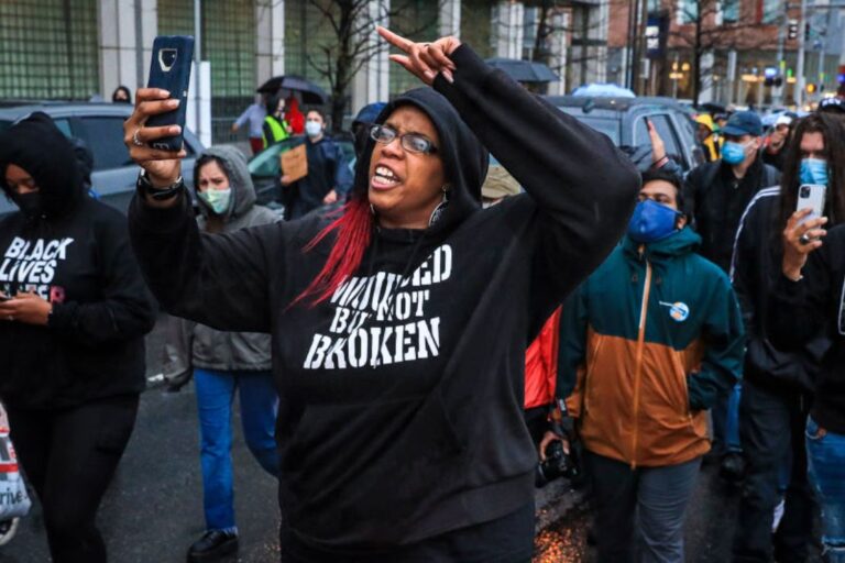 Monica Cannon-Grant leads demonstrators as they march from Nubian Square to BPD headquarters as they celebrate the conviction of former Minneapolis police officer Derek Chauvin and demand for an end to police brutality in Boston on April 21, 2021. (Photo by Erin Clark/The Boston Globe via Getty Images)
