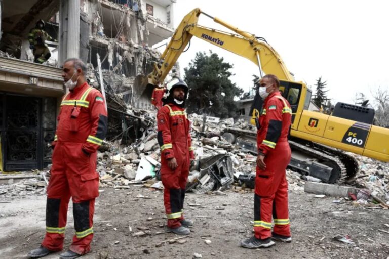 Emergency workers gather at the site of a strike on a residential building in Tehran, Iran, March 23, 2026 [Majid Asgaripour/WANA via Reuters]