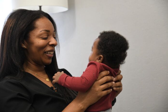 Shanille Bowens, a doula, smiles at Isaiah Stewart during an appointment on Feb. 28, 2026, in Memphis, Tenn. (AP Photo/Kristin M. Hall)