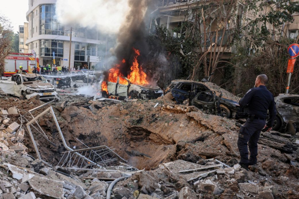 Emergency personnel respond at a site following Iranian missile barrages in central Israel, amid the US-Israel conflict with Iran, in Tel Aviv, Israel, March 24, 2026. Tomer Appelbaum/Reuters
