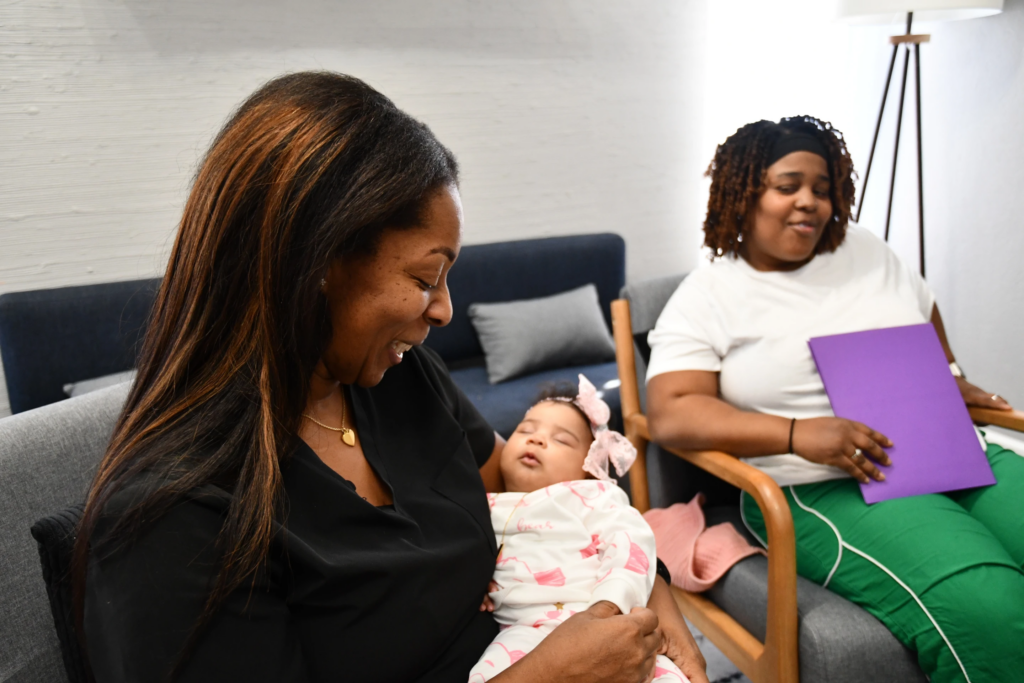 Mary Bey looks on while doula Shanille Bowens holds Bey’s daughter, Ca’Mya, during an appointment on Feb. 28, 2026, in Memphis, Tenn. (AP Photo/Kristin M. Hall)