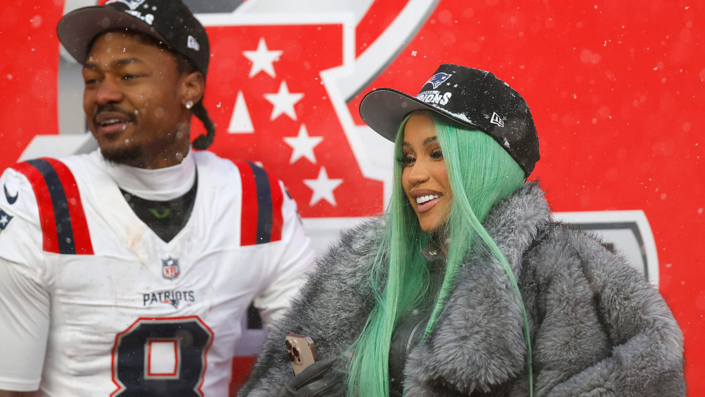 Cardi B and Stefon Diggs #8 of the New England Patriots celebrate following the AFC Championship Playoff game on January 25, 2026 in Denver, Colorado. (Photo by Justin Edmonds/Getty Images)