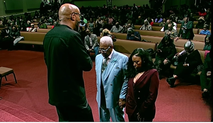 Rev. Frederick Douglass Haynes III prays over Rep. Jasmine Crockett, D-Texas, and her father, at Friendship-West Baptist Church in Dallas, Texas, on Sunday, December 7, 2025. | YouTube/Friendship-West Baptist Church