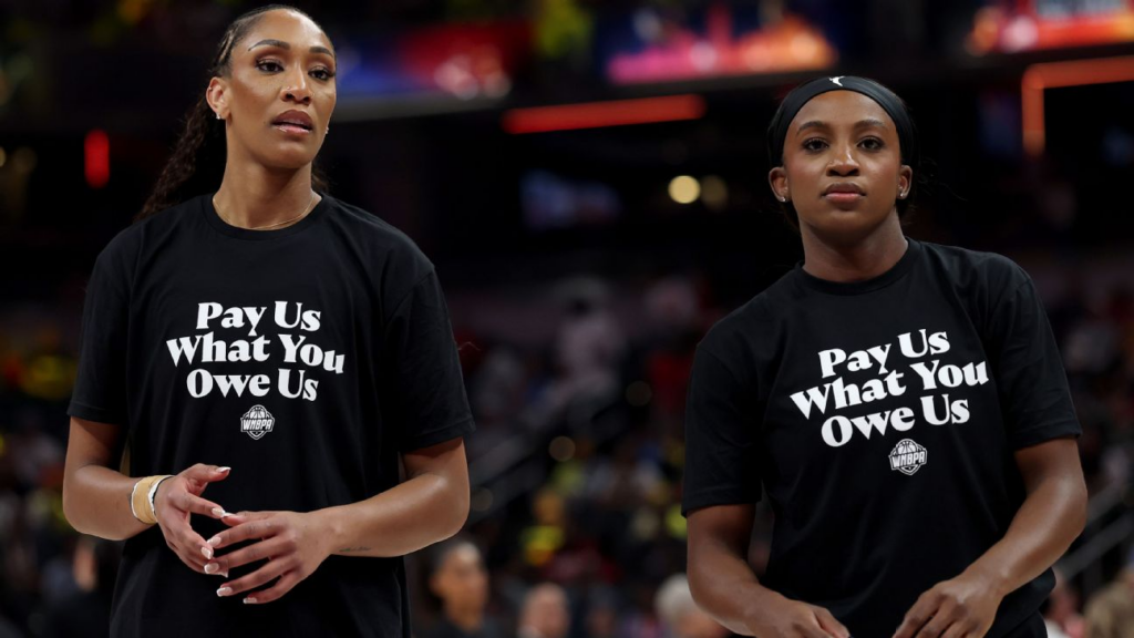 Before the WNBA All-Star Game on Saturday in Indianapolis, every player on court -- including A'ja Wilson and Jackie Young -- donned shirts that read, "Pay Us What You Owe Us." Steph Chambers/Getty Images