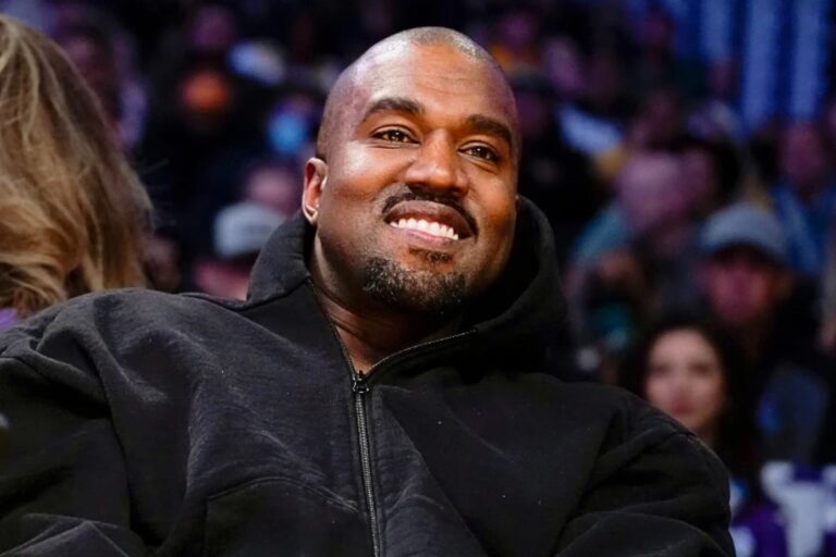Kanye West, known as Ye, watches the first half of an NBA basketball game between the Washington Wizards and the Los Angeles Lakers, on March 11, 2022, in Los Angeles. (AP Photo/Ashley Landis, File)
