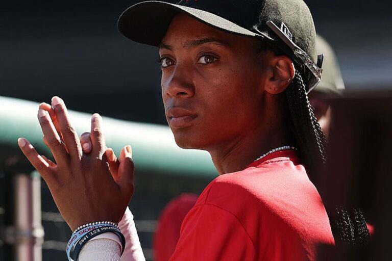 Mo'ne Davis watches game action from the dugout during the first of two exhibition games of the Women's Professional Baseball League at Nationals Park for players who made the final cut and will be eligible to be drafted August 25, 2025 in Washington, DC. The tryouts are the first women’s professional baseball tryouts to be held in over 80 years since the All American Girls Professional Baseball League in 1943. The Women’s Professional Baseball League will launch six teams in the spring of 2026 and feature a regular-season playoffs and championship. (Photo by Win McNamee/Getty Images)Credit: Photo Win McNamee / Getty Images