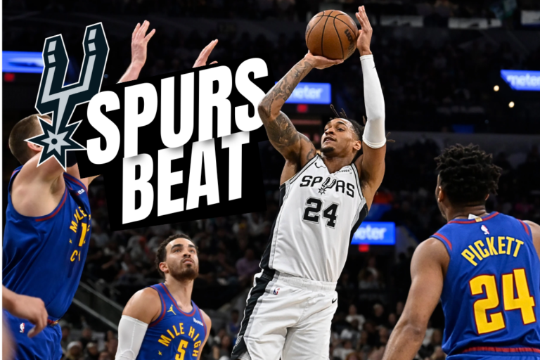 San Antonio Spurs guard Devin Vassell shoots against Denver Nuggets' Nikola Jokic, left, Tyus Jones (5) and Jalen Pickett, right, during the first half of an NBA basketball game, Sunday, April 12, 2026, in San Antonio. (AP Photo/Darren Abate)