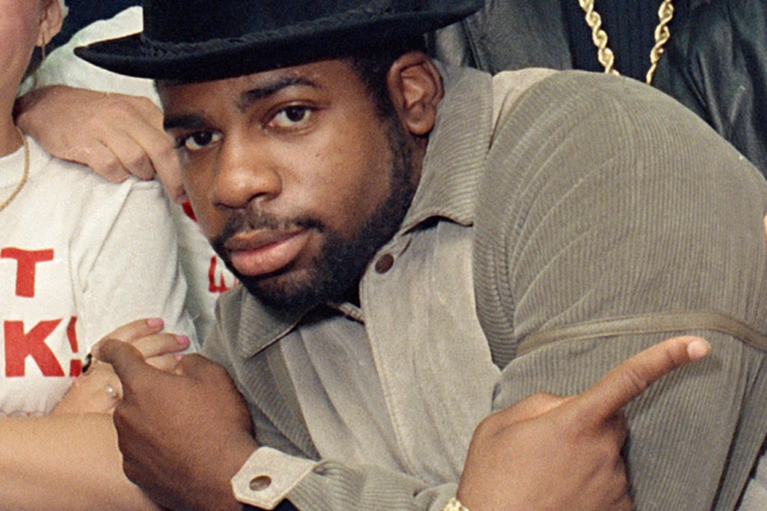 Run-D.M.C.'s Jason Mizell, Jam-Master Jay, poses with teenagers gathered at New York’s Madison Square Garden, Oct. 7, 1986, in New York City. (AP Photo/G. Paul Burnett, File)