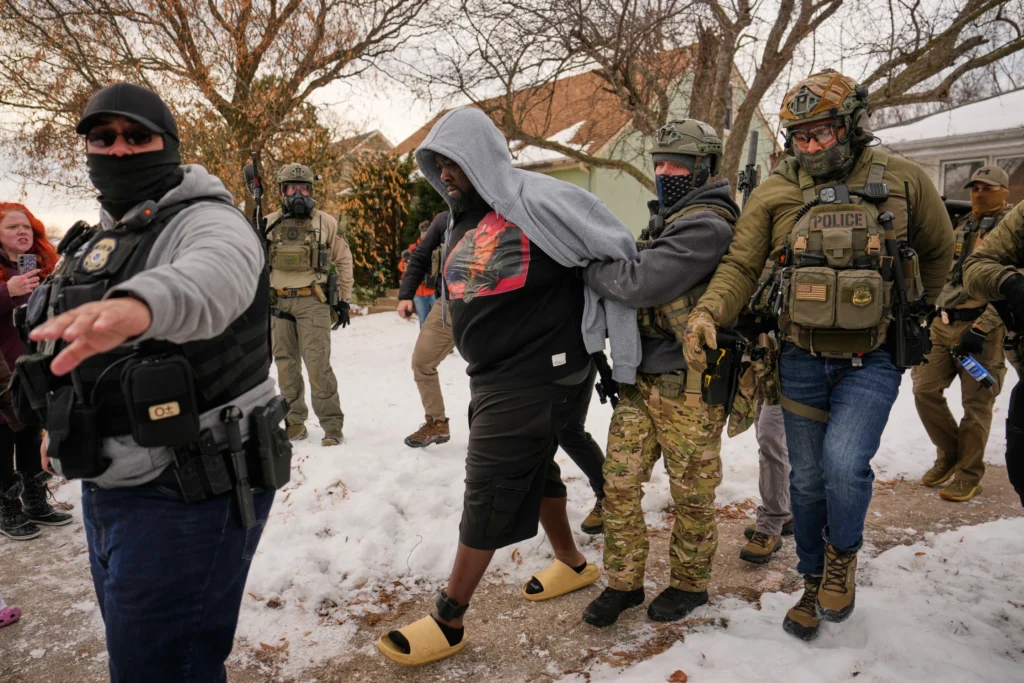 Garrison Gibson is arrested by federal immigration officers Jan. 11, 2026, in Minneapolis. (AP Photo/John Locher, File)