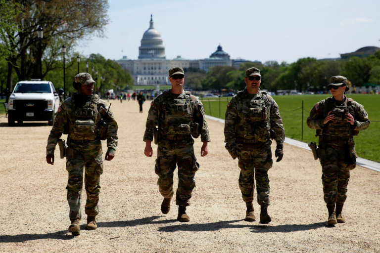 National Guard troops patrol the National Mall with the U.S. Capitol in the background on April 7, 2006, in Washington. (AP Photo/File)