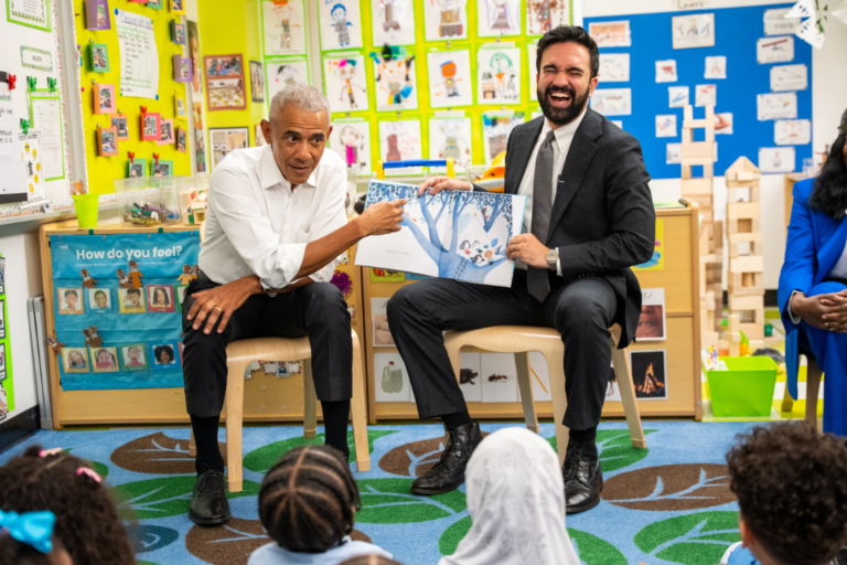 Former President Barack Obama and Mayor Zohran Mamdani sing "Wheels on the Bus" to children at Learning Through Play Pre-K in New York, Saturday, April 18, 2026. (AP Photo/Angelina Katsanis)
