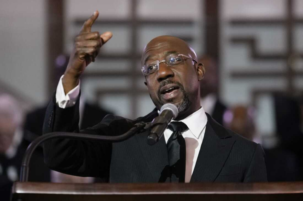 U.S. Sen. Raphael Warnock, D-Ga., a senior pastor at Ebenezer Baptist Church, speaks at the church, Jan. 15, 2023, in Atlanta. Carolyn Kaster/AP
