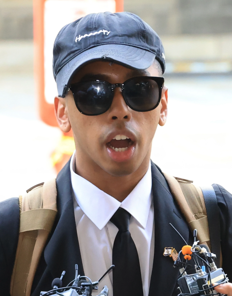 American YouTuber Johnny Somali speaks to reporters as he arrives at the Seoul Western District Court in Seoul, South Korea, Wednesday, April 15, 2026. (Choi Jae-koo/Yonhap via AP)