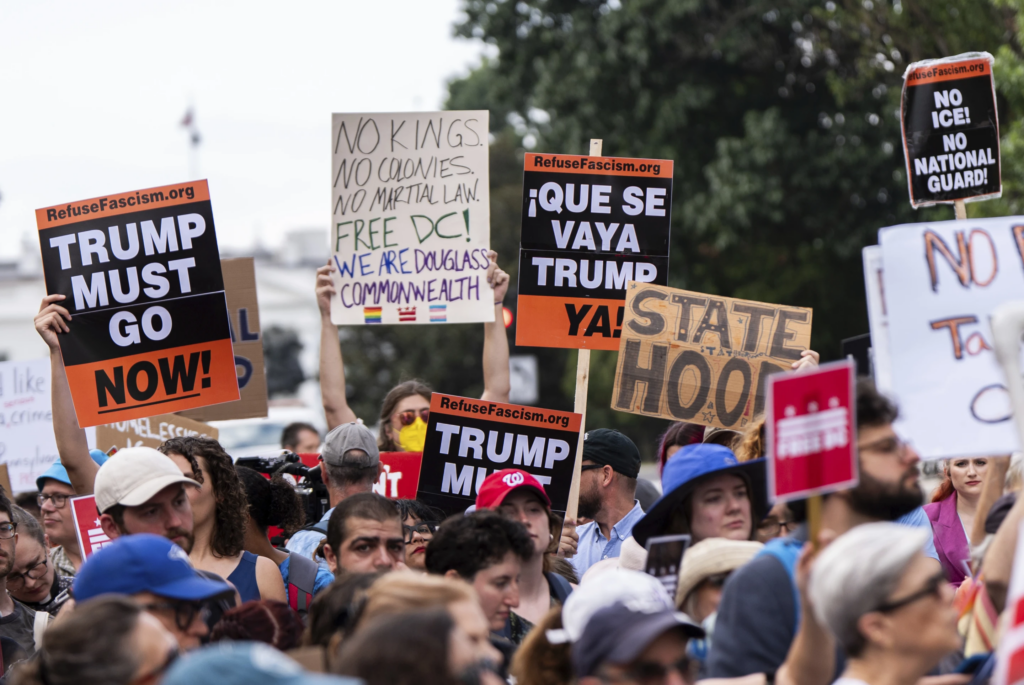 Protesters demonstrate against President Donald Trump’s planned use of federal law enforcement and National Guard troops in Washington, during a rally in front of the White House, Monday, Aug. 11, 2025, in Washington. (AP Photo/Julia Demaree Nikhinson)